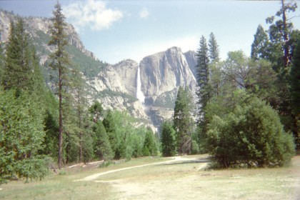 Meadow with waterfall in background.