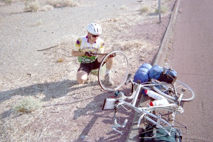 Frank fixing a flat by the side of the road