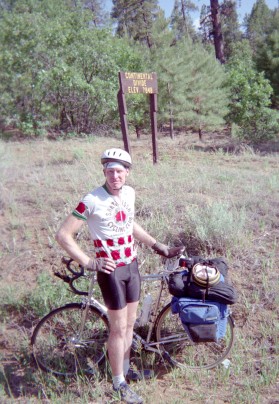 Alan in front of Contintntal Divide sign