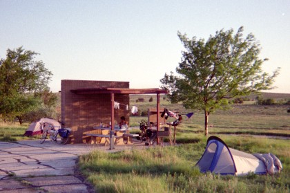 Tents pitched next to campsite with picnic table shelter