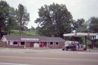 Single-story building with gas pumps in front