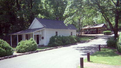 Wood-sided building amongst the trees
