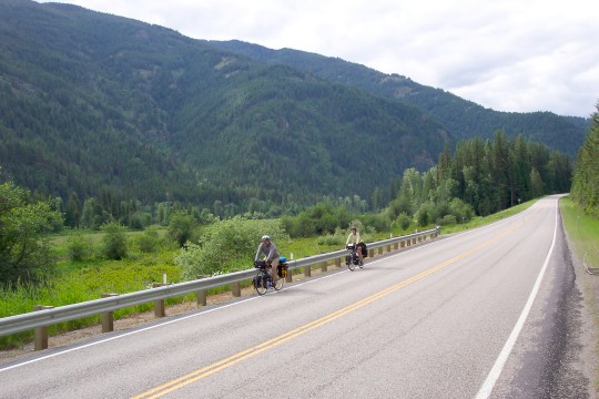 Don and Maddy riding with mountain in background