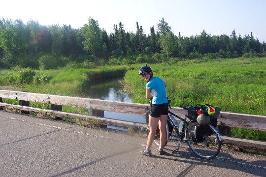 Maddy on bridge over the Mississippi, a small stream here