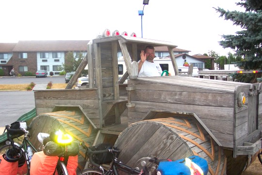 Don at the wheel of a wooden tractor