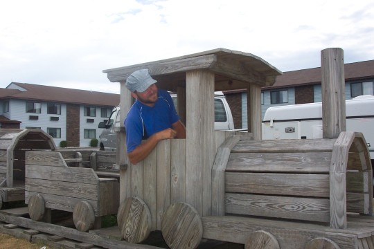 Eric at the throttle of a wooden locomotive