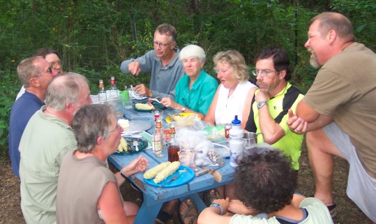 The group sitting down to a steak dinner