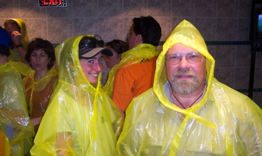 Maddy and Don in yellow plastic rain coats with hoods