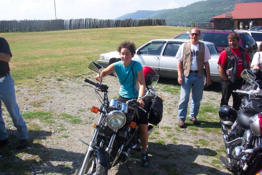 Maddy clowning around on a (parked) motorcycle