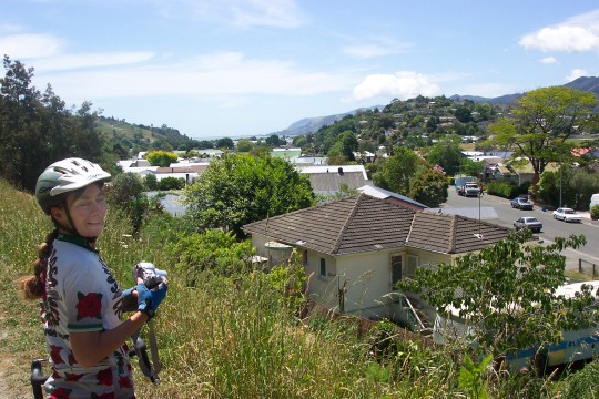 Sue on bike path overlooking Nelson