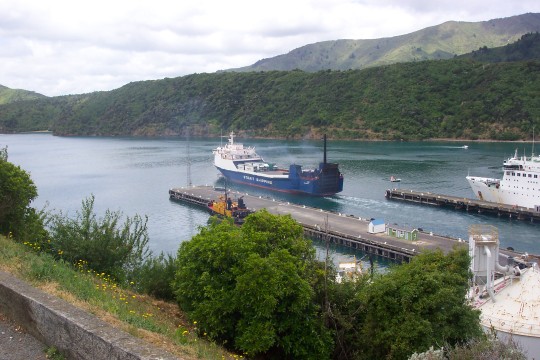 A freighter pulling out from the dock
