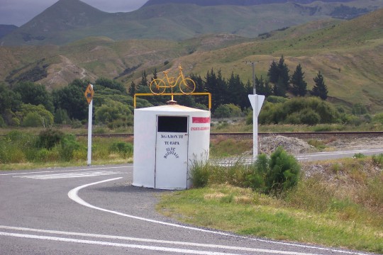 Water tank with bicycle sculpture on top