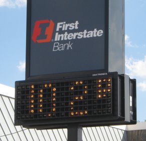 Bank time/temperature sign reading 102 degrees