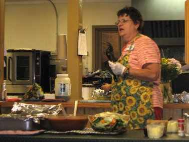 Lady talking with food in foreground