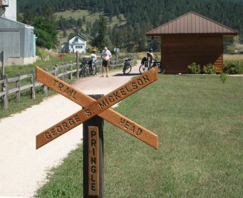 X-shaped sign like RR crossing that says, 'Trail Head George S. Mickelson