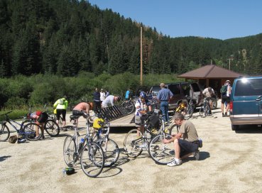 Riders preparing bikes around the trailer
