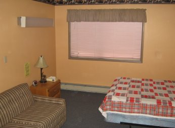 View of sofa, window and bed