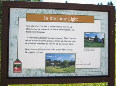 Signboard 'In the Lime Light' about old lie mine