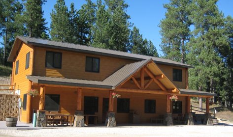 Large rustic two-story building with porch