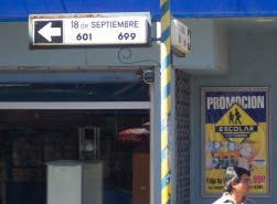 Street sign with one-way arrow