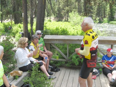 Marcia, Beth, Claudine, Linda, Alfred, and Liz on a wooden deck by a stream