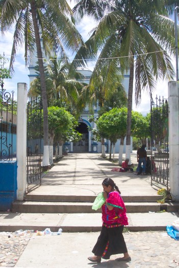 Church with woman walking in front