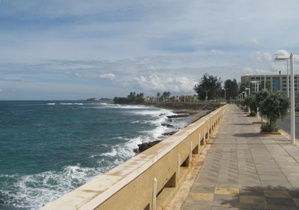 Pathway next to wall bordering the ocean