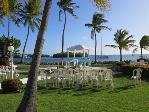 Tables and canopy set for wedding on lawn