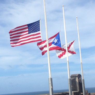 Three flags flying in the breeze