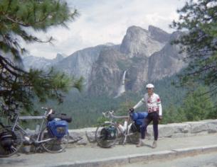 Cyclist & bike in Yosemite with Half Dome in background
